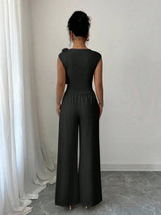 PEPLUM ROUND NECK TOP ASYMMETRICAL HEM AND LONG PANTS