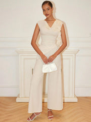 PEPLUM ROUND NECK TOP ASYMMETRICAL HEM AND LONG PANTS